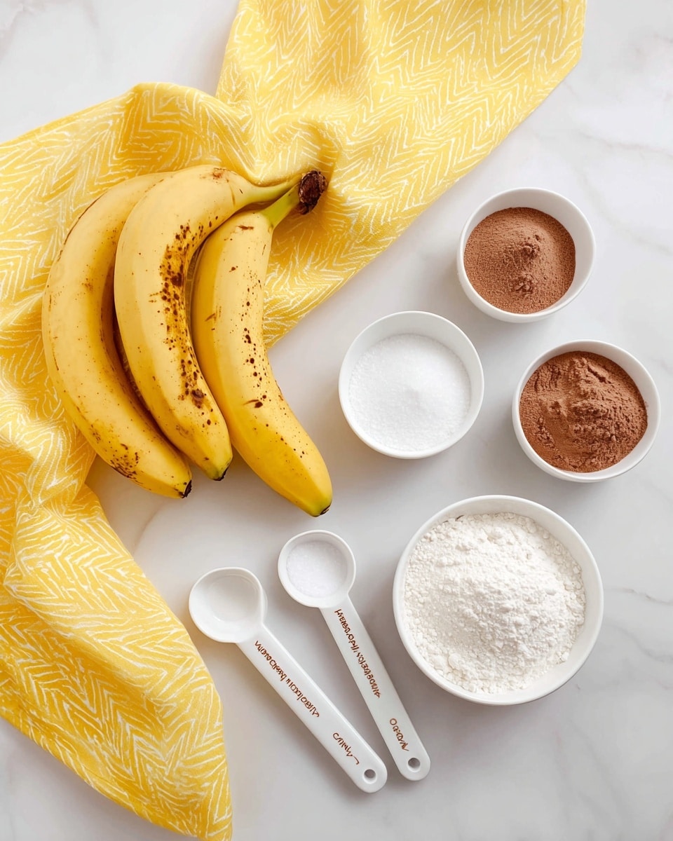 The image shows a flat lay of ingredients on a white marbled surface. There are two ripe yellow bananas with brown spots positioned in the lower left center, a cluster of four similar bananas in the top left, and three small white bowls arranged vertically on the right side filled with brown powder at the top, white granulated sugar in the middle, and white flour at the bottom. Two white ceramic measuring spoons with brown writing lie diagonally near the bottom left. A bright yellow cloth with white zigzag patterns is draped on the top right edge. The lighting is soft and natural, creating clear, warm tones. Photo taken with an iphone --ar 4:5 --v 7