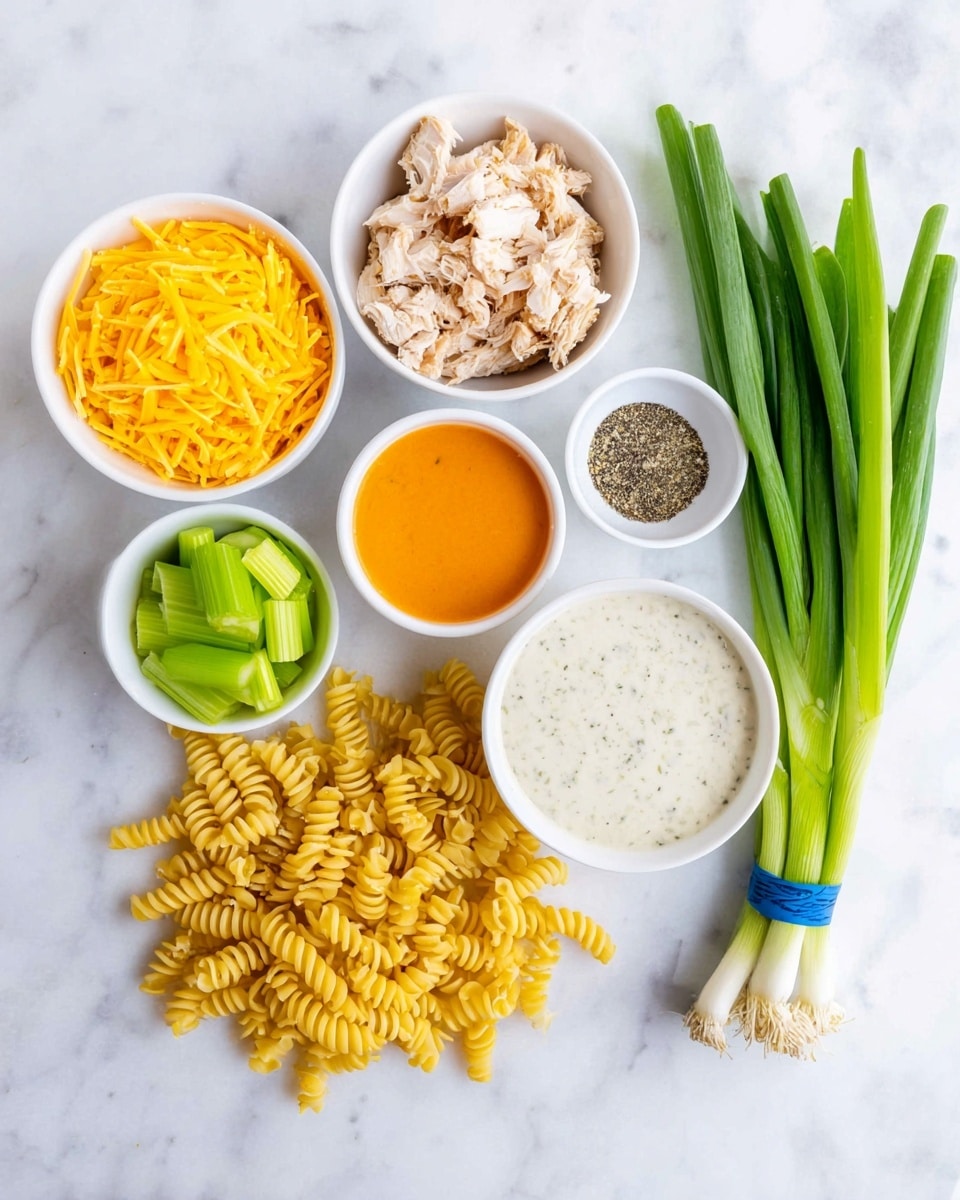 The image shows different ingredients arranged on a white marbled surface. There are six white bowls: one filled with bright yellow shredded cheese, one with pieces of cooked chicken meat with a light brown color, one containing bright orange sauce, one with light green sliced celery, one filled with a creamy white sauce with small specks, and one holding a mix of black pepper and garlic powder. Below the bowls, there is a pile of uncooked yellow spiral pasta. On the right side, a bunch of fresh green onions with white bulbs is tied with a blue rubber band. All items are neatly placed and clearly visible. photo taken with an iphone --ar 4:5 --v 7