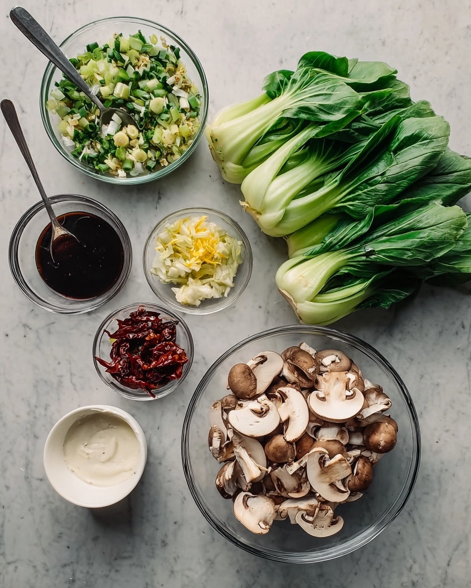 A clear glass bowl filled with sliced light brown mushrooms with white insides occupies the bottom right. Above it, a bunch of fresh green bok choy with light green and white stalks is spread out. To the left, a clear bowl contains finely chopped green and white vegetables mixed with yellow bits. Below that is a small clear bowl holding three dried red chilies. Next to it is a clear glass bowl with dark sauce and a silver spoon resting inside. At the bottom left, a white bowl carries a thick white sauce with a silver spoon in it. All items are arranged on a white marbled surface. Photo taken with an iphone --ar 4:5 --v 7